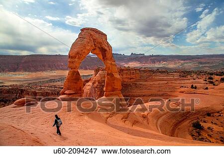 Delicate Arch stands prominent during threatening skies at Arches National Park, Utah. View Large Photo Image Stock Photo - Delicate Arch stands prominent during threatening skies at Arches National Park, Utah.. Fotosearch