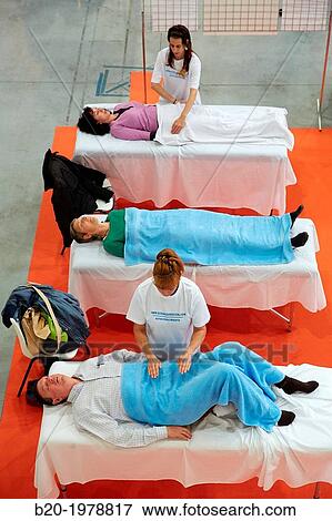 Demonstration of alternative therapies, Bioterra, fair of organic products, green building, renewable energy and responsible consumption, Ficoba, Irun, Gipuzkoa, Basque Country, Spain. View Large Photo Image Stock Photo - Demonstration of alternative therapies, Bioterra, fair of organic products, green building, renewable energy and responsible consumption, Ficoba, Irun, Gipuzkoa, Basque Country, Spain.. Fotosearch