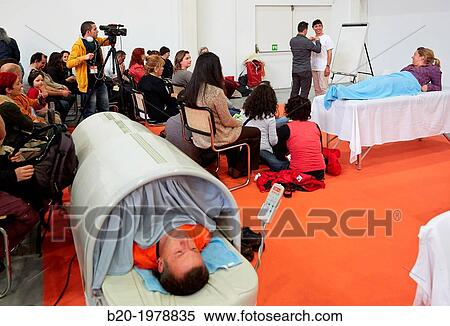 Demonstration of alternative therapies, Bioterra, fair of organic products, green building, renewable energy and responsible consumption, Ficoba, Irun, Gipuzkoa, Basque Country, Spain. View Large Photo Image Stock Photography - Demonstration of alternative therapies, Bioterra, fair of organic products, green building, renewable energy and responsible consumption, Ficoba, Irun, Gipuzkoa, Basque Country, Spain.. Fotosearch