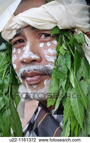 Denpasar (Bali, Indonesia): a Balinese man with facial paintings at the Bali Arts Festival opening View Large Photo Image Stock Image - Denpasar (Bali, Indonesia): a Balinese man with facial paintings at the Bali Arts Festival opening. Fotosearch