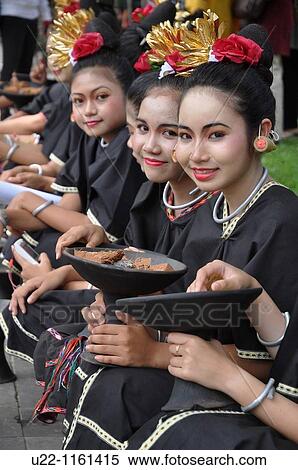 Denpasar (Bali, Indonesia): Balinese girls at the Bali Arts Festival opening View Large Photo Image Stock Photography - Denpasar (Bali, Indonesia): Balinese girls at the Bali Arts Festival opening. Fotosearch