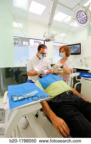 Stock Image - Dental intervention, Dental office/Dental surgery, Donostia-San SebastiBn, Guipuzcoa, Basque Country, Spain. Fotosearch