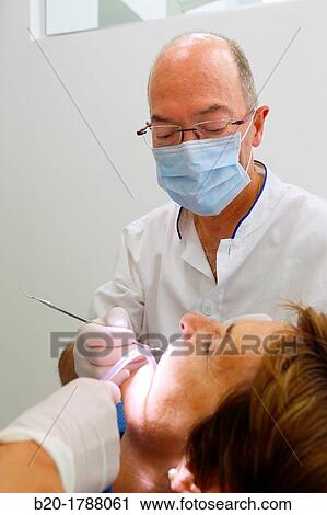 Stock Image - Dental intervention, Dental office/Dental surgery, Donostia-San SebastiBn, Guipuzcoa, Basque Country, Spain. Fotosearch