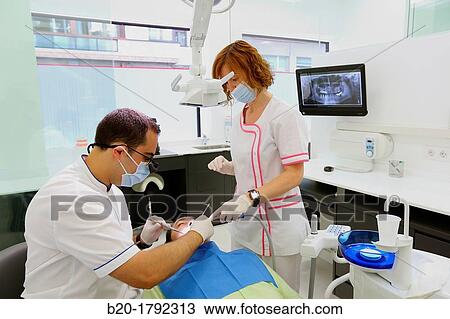 Stock Image - Dental intervention, Dental office/Dental surgery, Donostia-San SebastiBn, Guipuzcoa, Basque Country, Spain. Fotosearch
