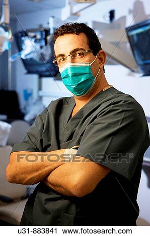 Dentist posing in front of dental facility View Large Photo Image Stock Image - Dentist posing in front of dental facility. Fotosearch