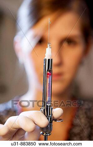 Dentist showing anesthesia injection View Large Photo Image Stock Image - Dentist showing anesthesia injection. Fotosearch