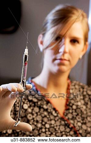 Dentist showing anesthesia injection View Large Photo Image Stock Image - Dentist showing anesthesia injection. Fotosearch