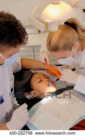 Stock Photo - Dentists with patient. Fotosearch