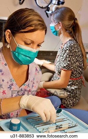Dentists working on a patient View Large Photo Image Stock Image - Dentists working on a patient. Fotosearch