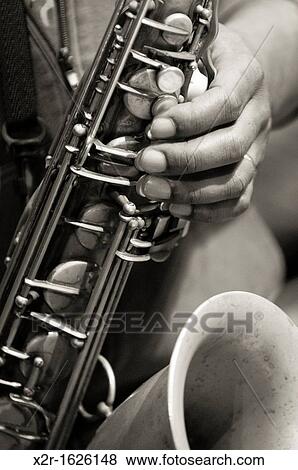 Denys Baptiste playing tenor saxophone during sound checks at the Turner Sims Concert Hall in Southampton, Hampshire, England View Large Photo Image Stock Photo - Denys Baptiste playing tenor saxophone during sound checks at the Turner Sims Concert Hall in Southampton, Hampshire, England. Fotosearch