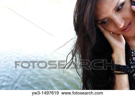Depressed 25 year old pretty woman outdoors near pond, close-up shot View Large Photo Image Stock Photo - Depressed 25 year old pretty woman outdoors near pond, close-up shot. Fotosearch