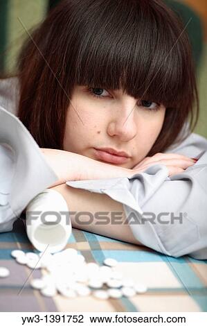 depression - women and drags open pack of pills on the table View Large Photo Image Stock Image - depression - women and drags open pack of pills on the table. Fotosearch