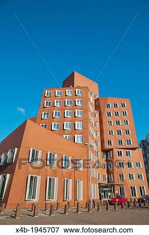 Stock Photo - Der Neuer Zollhof buildings by F Gehry Medienhafen the Media Harbour area Dusseldorf city Germany Europe.. Fotosearch