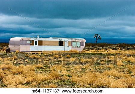Desolate and abandoned mobile home trailer in the southern California desert View Large Photo Image Stock Photo - Desolate and abandoned mobile home trailer in the southern California desert. Fotosearch
