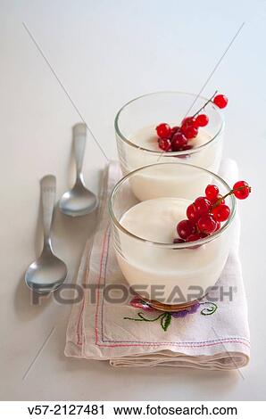 Stock Image - Dessert: cream with redcurrants.. Fotosearch