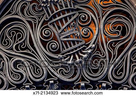 Detail above the Main Door of Palau Guell designed by Gaudi in Barcelona, Catalonia, Spain. View Large Photo Image Stock Image - Detail above the Main Door of Palau Guell designed by Gaudi in Barcelona, Catalonia, Spain.. Fotosearch
