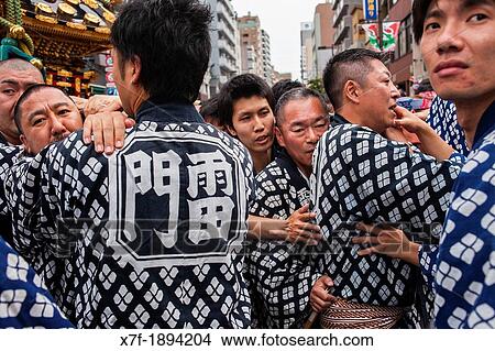 Picture - Detail, bearers of Mikoshi, Sanja Matsuri Festival, in Kaminarimon dori, next to Sensoji Temple, Asakusa, Tokyo, Japan, Asia. Fotosearch