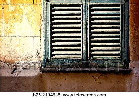 Detail of a closed window shutter on a block of flats in Ciutadella, Menorca, Balearic islands, Spain. View Large Photo Image Stock Photography - Detail of a closed window shutter on a block of flats in Ciutadella, Menorca, Balearic islands, Spain.. Fotosearch
