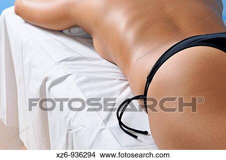 Picture - Detail of a relaxed young woman body at a health spa. Fotosearch