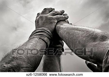 Stock Photograph - Detail of Castellers, Catalan human castles declared UNESCO element of Intangible Cultural Heritage of Humanity. Fotosearch