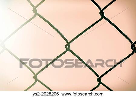 Detail of chain link fence and morning sunlight. View Large Photo Image Stock Photograph - Detail of chain link fence and morning sunlight.. Fotosearch
