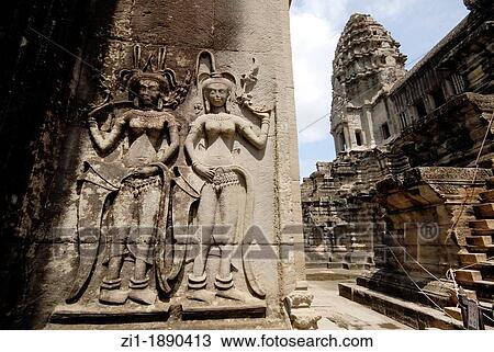 Stock Image - detail of decoration at wall in Angkor Wat, Cambodia. Fotosearch
