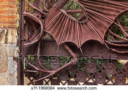 Picture - Detail of dragon on iron gate at Pavellons de la Finca Guell, by Antonio Gaudi. Barcelona. Catalonia. Spain.. Fotosearch