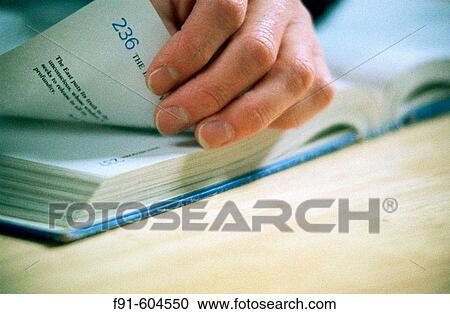 Detail of hands turning page in book View Large Photo Image Stock Image - Detail of hands turning page in book. Fotosearch