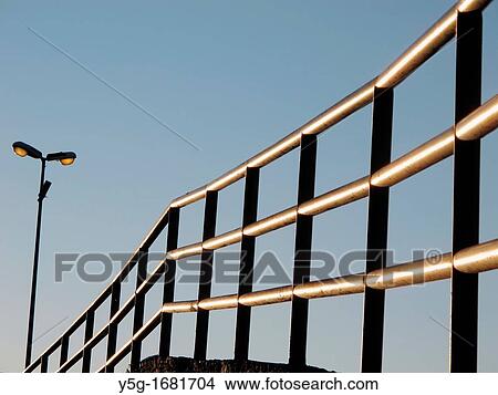 detail of metal steel fence on hill with blue sky View Large Photo Image Picture - detail of metal steel fence on hill with blue sky. Fotosearch