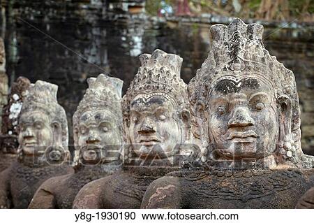 Detail of the stone faces on the bridge at the south gate of Angkor Thom, Angkor Temples complex, Cambodia, Asia View Large Photo Image Stock Image - Detail of the stone faces on the bridge at the south gate of Angkor Thom, Angkor Temples complex, Cambodia, Asia. Fotosearch