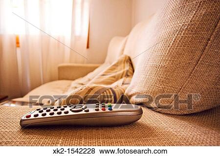 Detail of the TV remote Control on the sofa View Large Photo Image Stock Photo - Detail of the TV remote Control on the sofa. Fotosearch