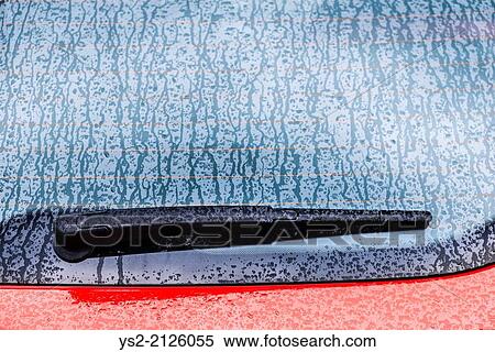 Detail of wet red car. Windshield wiper and a rainy window. View Large Photo Image Stock Photography - Detail of wet red car. Windshield wiper and a rainy window.. Fotosearch