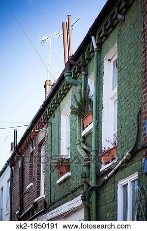 Detail of windows and pipes in a green bricklayer house near Shepherd's Bush, Notting Hill, London View Large Photo Image Stock Image - Detail of windows and pipes in a green bricklayer house near Shepherd's Bush, Notting Hill, London. Fotosearch