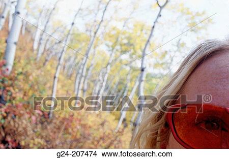 Detail of woman's eye with slider sunglasses View Large Photo Image Picture - Detail of woman's eye with slider sunglasses. Fotosearch