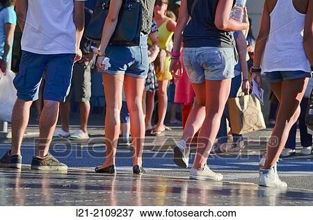 Detail of young legs in shorts in a street, summer. Barcelona, Catalonia, Spain. View Large Photo Image Stock Photo - Detail of young legs in shorts in a street, summer. Barcelona, Catalonia, Spain.. Fotosearch