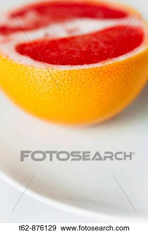 Detail photo of a grapefruit on a plate Still Life View Large Photo Image Stock Photo - Detail photo of a grapefruit on a plate Still Life. Fotosearch