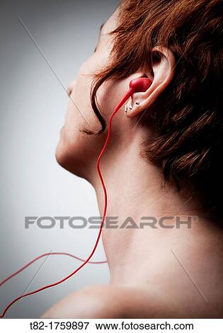 detailed profile of young woman with short hair listening to music on musical instrument View Large Photo Image Stock Photo - detailed profile of young woman with short hair listening to music on musical instrument. Fotosearch