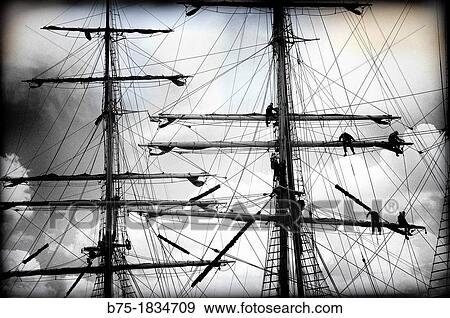 Detalle de marineros trabajando en los mastiles de un barco de epoca, Detail of sailors working on the masts of a vintage yacht, View Large Photo Image Stock Photo - Detalle de marineros trabajando en los mastiles de un barco de epoca, Detail of sailors working on the masts of a vintage yacht,. Fotosearch
