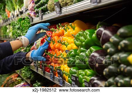 Detroit, Michigan - A worker stocks produce at a Whole Foods Market on the day of the store's opening in midtown Detroit. View Large Photo Image Stock Image - Detroit, Michigan - A worker stocks produce at a Whole Foods Market on the day of the store's opening in midtown Detroit.. Fotosearch