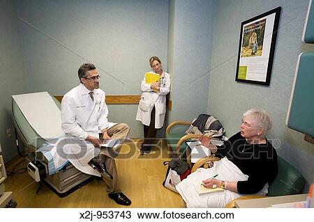 Detroit, Michigan - Dr Robert Morris and nurse practitioner Sarah Jacob interview ovarian cancer patient Pat Lancaster View Large Photo Image Stock Image - Detroit, Michigan - Dr Robert Morris and nurse practitioner Sarah Jacob interview ovarian cancer patient Pat Lancaster. Fotosearch