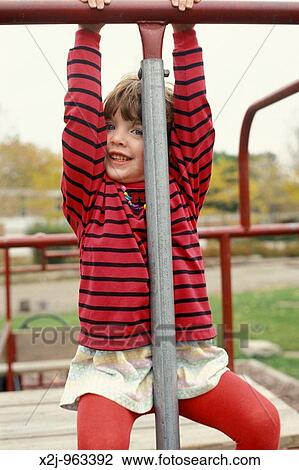 Detroit, Michigan - Four year old Mariel West, a pre-kindergarten student at Friends School in Detroit, plays on the school's playground MR View Large Photo Image Stock Image - Detroit, Michigan - Four year old Mariel West, a pre-kindergarten student at Friends School in Detroit, plays on the school's playground MR. Fotosearch