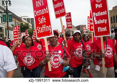 Detroit, Michigan - Health care workers, members of the United Auto Workers union, join a march commemorating the 50th anniversary of Dr. Martin Luther King Jr. 's 1963 "Walk to Freedom. ". View Large Photo Image Stock Image - Detroit, Michigan - Health care workers, members of the United Auto Workers union, join a march commemorating the 50th anniversary of Dr. Martin Luther King Jr. 's 1963 "Walk to Freedom. ".. Fotosearch