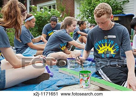 Detroit, Michigan - High school students paint pickets for a picket fence They are volunteers working in the Summer in the City program, which puts students to work on community improvement projects View Large Photo Image Stock Image - Detroit, Michigan - High school students paint pickets for a picket fence They are volunteers working in the Summer in the City program, which puts students to work on community improvement projects. Fotosearch