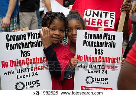 Stock Photography - Detroit, Michigan - Hotel workers and their children join gay and lesbian activists marching for equality in the Motor City Pride parade. The hotel workers are campaigning for a union contract at the Crowne Plaza Pontchartrain.. Fotosearch
