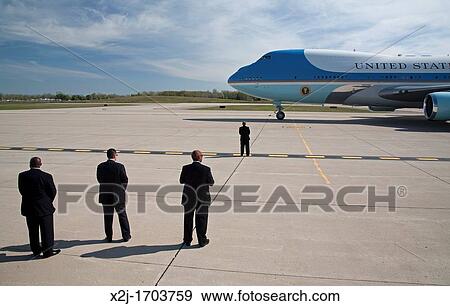 Detroit, Michigan - Security personnel stand watch as President Barack Obama arrives at Detroit Metro Airport on Air Force 1 View Large Photo Image Stock Photo - Detroit, Michigan - Security personnel stand watch as President Barack Obama arrives at Detroit Metro Airport on Air Force 1. Fotosearch