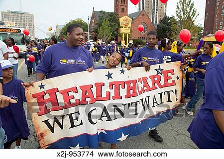 Detroit, Michigan - Union members campaign for health care reform during the Labor Day parade View Large Photo Image Picture - Detroit, Michigan - Union members campaign for health care reform during the Labor Day parade. Fotosearch