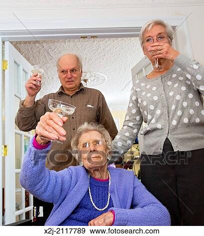 Detroit, Michigan - Woman celebrates her 100th birthday with her daughter and son View Large Photo Image Stock Photo - Detroit, Michigan - Woman celebrates her 100th birthday with her daughter and son. Fotosearch