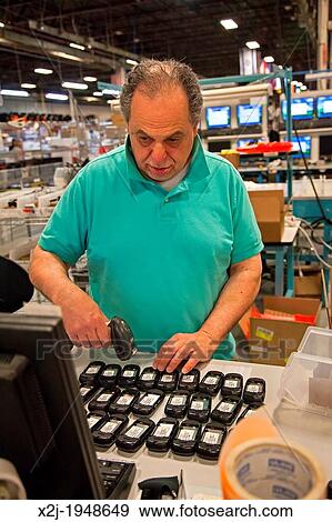 Dexter, Michigan - Cell phone recycling at ReCellular, Inc. The company collects used phones, inspects and repairs them, and resells them. Some of the work is done for charities, which collect used phones and profit from the re-sales. View Large Photo Image Stock Photo - Dexter, Michigan - Cell phone recycling at ReCellular, Inc. The company collects used phones, inspects and repairs them, and resells them. Some of the work is done for charities, which collect used phones and profit from the re-sales.. Fotosearch