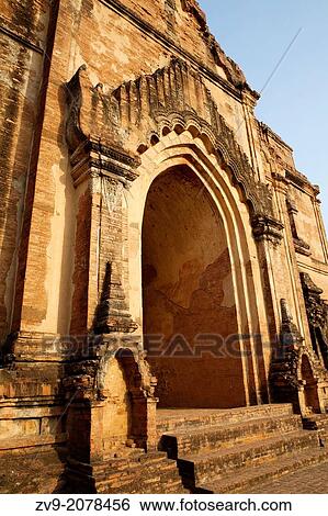 Dhamma Yan Gyi Pahto is a massive walled 12th century temple known by the local Burmese as "bac luck temple". The western shrine within the temple contains two original side by side images of Guatama and Maitreye Buddha - the historical and future Buddhas View Large Photo Image Stock Photograph - Dhamma Yan Gyi Pahto is a massive walled 12th century temple known by the local Burmese as "bac luck temple". The western shrine within the temple contains two original side by side images of Guatama and Maitreye Buddha - the historical and future Buddhas. Fotosearch
