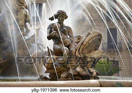 Diana fountain on the Archimede Square (Piazza Archimede), Ortigia, Syracuse (Siracusa, Syracuse), Sicily, Italy UNESCO. View Large Photo Image Stock Photograph - Diana fountain on the Archimede Square (Piazza Archimede), Ortigia, Syracuse (Siracusa, Syracuse), Sicily, Italy UNESCO.. Fotosearch
